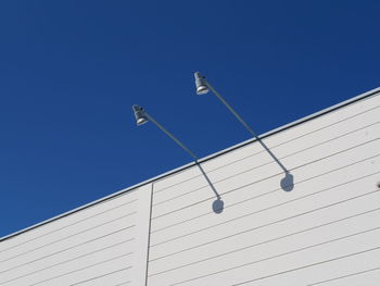 Low angle view of building against clear blue sky
