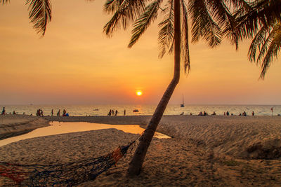 Scenic view of beach against sky during sunset