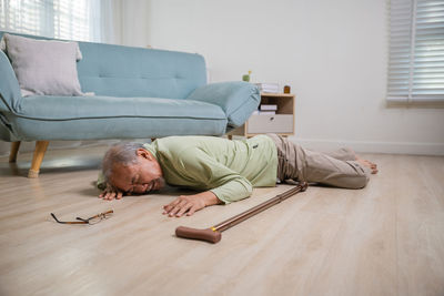 Portrait of woman sitting on sofa at home