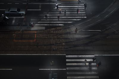 High angle view of people walking on illuminated steps