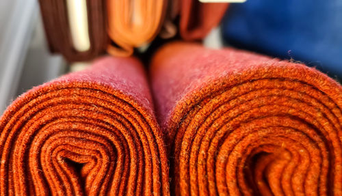 Samples of cloth and fabrics in different colors found at a fabrics market.