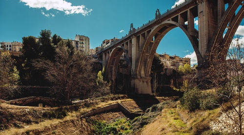 Low angle view of san jordi bridge against sky in city