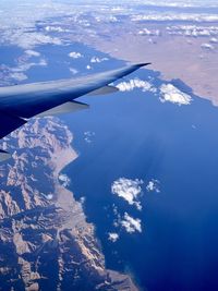 Aerial view of arabian landscape with crop of airplane wing 