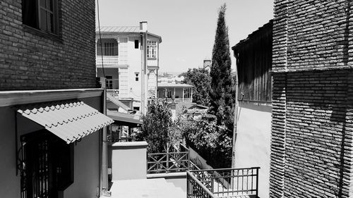 Houses against sky in city