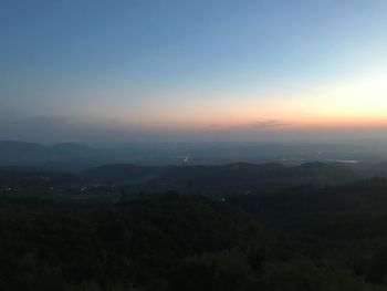 Scenic view of landscape against sky during sunset