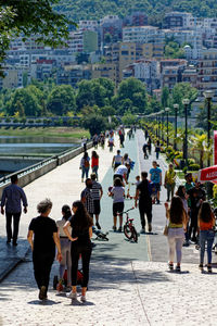People walking on street in city
