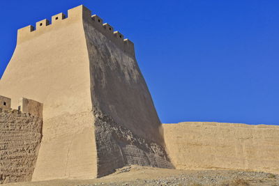 Low angle view of building against blue sky