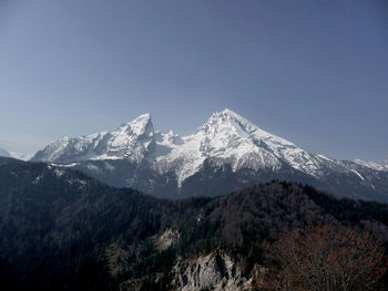 Scenic view of snowcapped mountains against clear sky