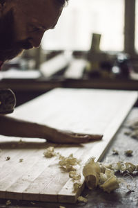 Man working on table at workshop