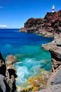 Scenic view of sea against blue sky