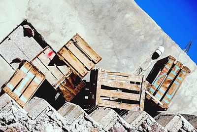 Information sign on built structure against sky