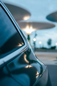 Close-up of car on road