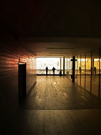 Rear view of silhouette people walking in subway