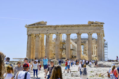 Group of people in front of historical building