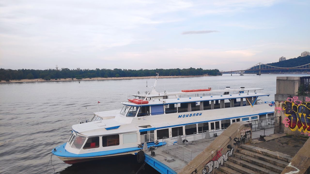 water, nautical vessel, transportation, ferry, sky, mode of transportation, vehicle, sea, passenger ship, nature, pier, travel, boat, architecture, travel destinations, ship, harbor, cloud, moored, craft, tourism, day, holiday, no people, beach, watercraft, outdoors, dock, vacation, land, trip, scenics - nature, beauty in nature, built structure, landscape, tranquility, jetty