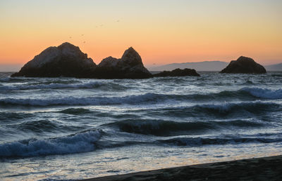 Scenic view of sea against sky during sunset