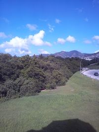 Scenic view of mountains against cloudy sky