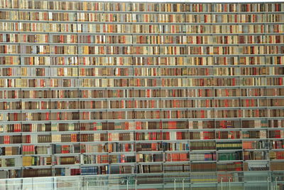 Full frame shot of books arranged on shelf in library