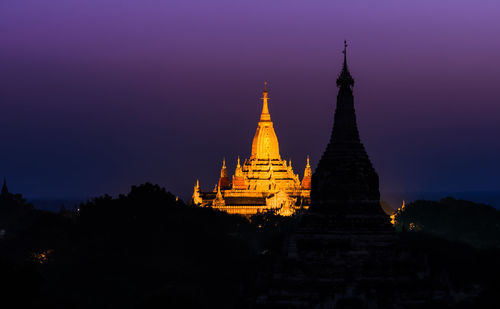 Silhouette of temple against sky at sunset