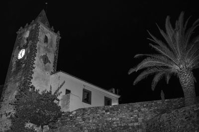 Low angle view of built structure at night