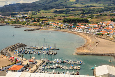 Boats moored in lake