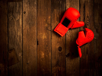 Close-up of red toy on wooden box