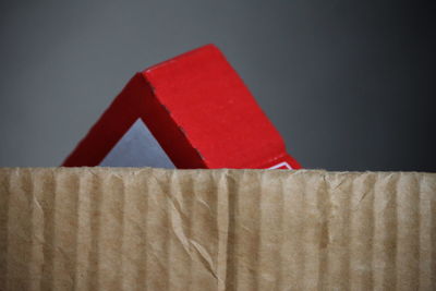 Close-up of red toy against white background