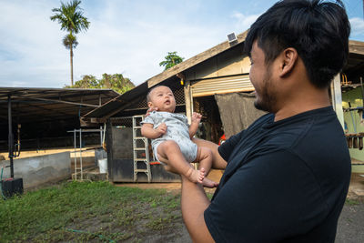 Full length of father and son