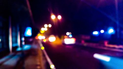 Defocused image of illuminated city at night