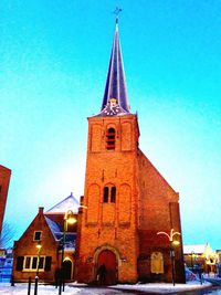 Low angle view of church against blue sky