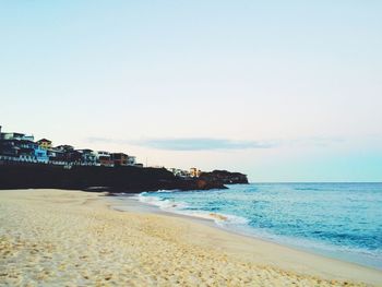 View of calm beach against sky