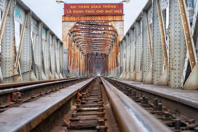 Surface level of railroad tracks against sky