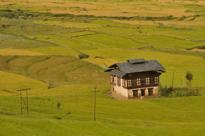 A typical bhutanese house on a firmland at punakha. arindam mukherjee..