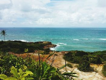 Scenic view of sea against cloudy sky