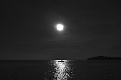 Scenic view of sea against sky at night