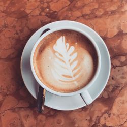 High angle view of cappuccino on table