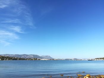 Scenic view of sea against clear blue sky