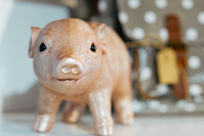 Close-up of animal representation on table