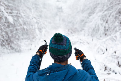 Rear view of man wearing hat