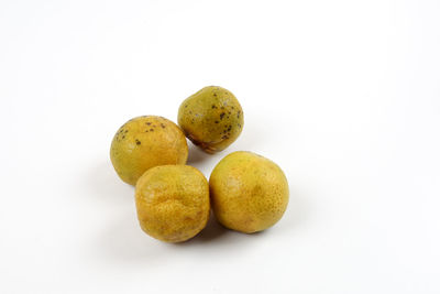 Close-up of fruits against white background