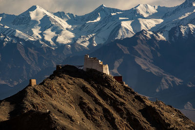 Scenic view of snowcapped mountains against sky