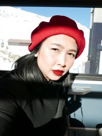 Portrait of beautiful young woman in hat