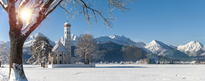 Panoramic view of snowcapped mountains against clear sky