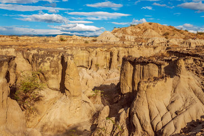 Idyllic shot of rock formations at tatacoa desert against sky