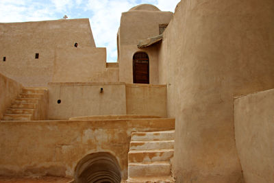 Low angle view of old building against sky