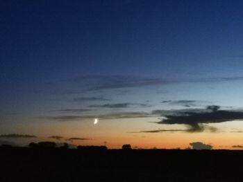 Scenic view of silhouette landscape against sky at sunset