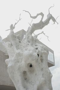 Low angle view of cross on snow