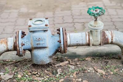 Close-up of fire hydrant against wall