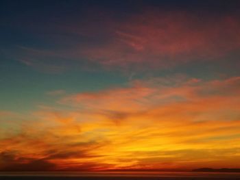 Low angle view of dramatic sky during sunset