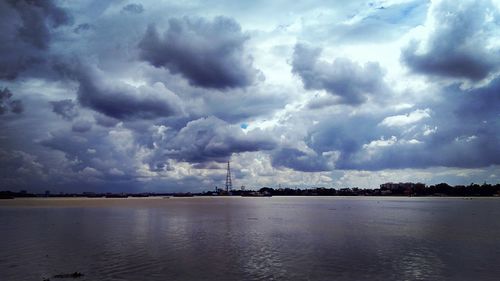 View of calm sea against cloudy sky